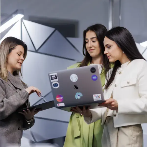 Colleagues working on a laptop