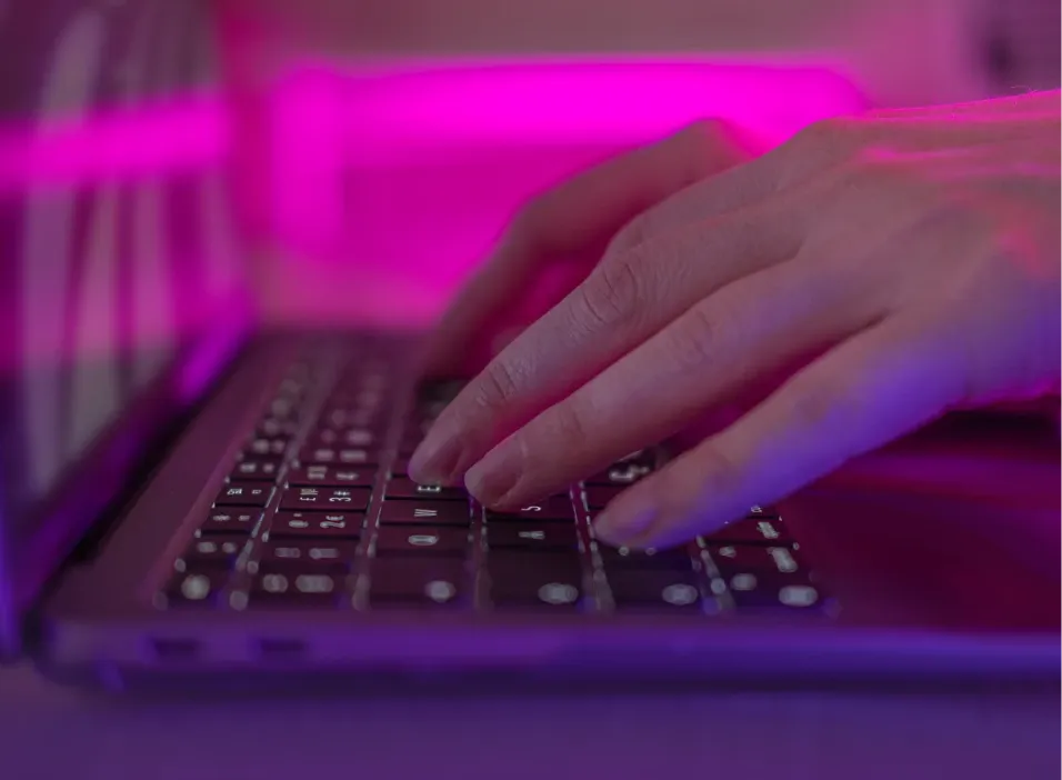 Person writing on keyboard