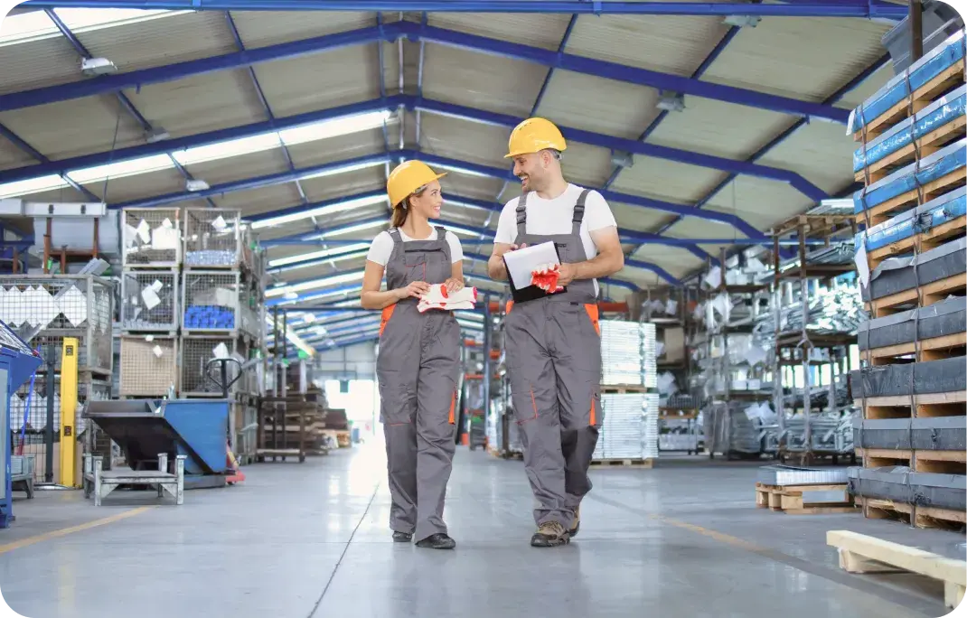 Image showing workers and machinery inside a manufacturing facility