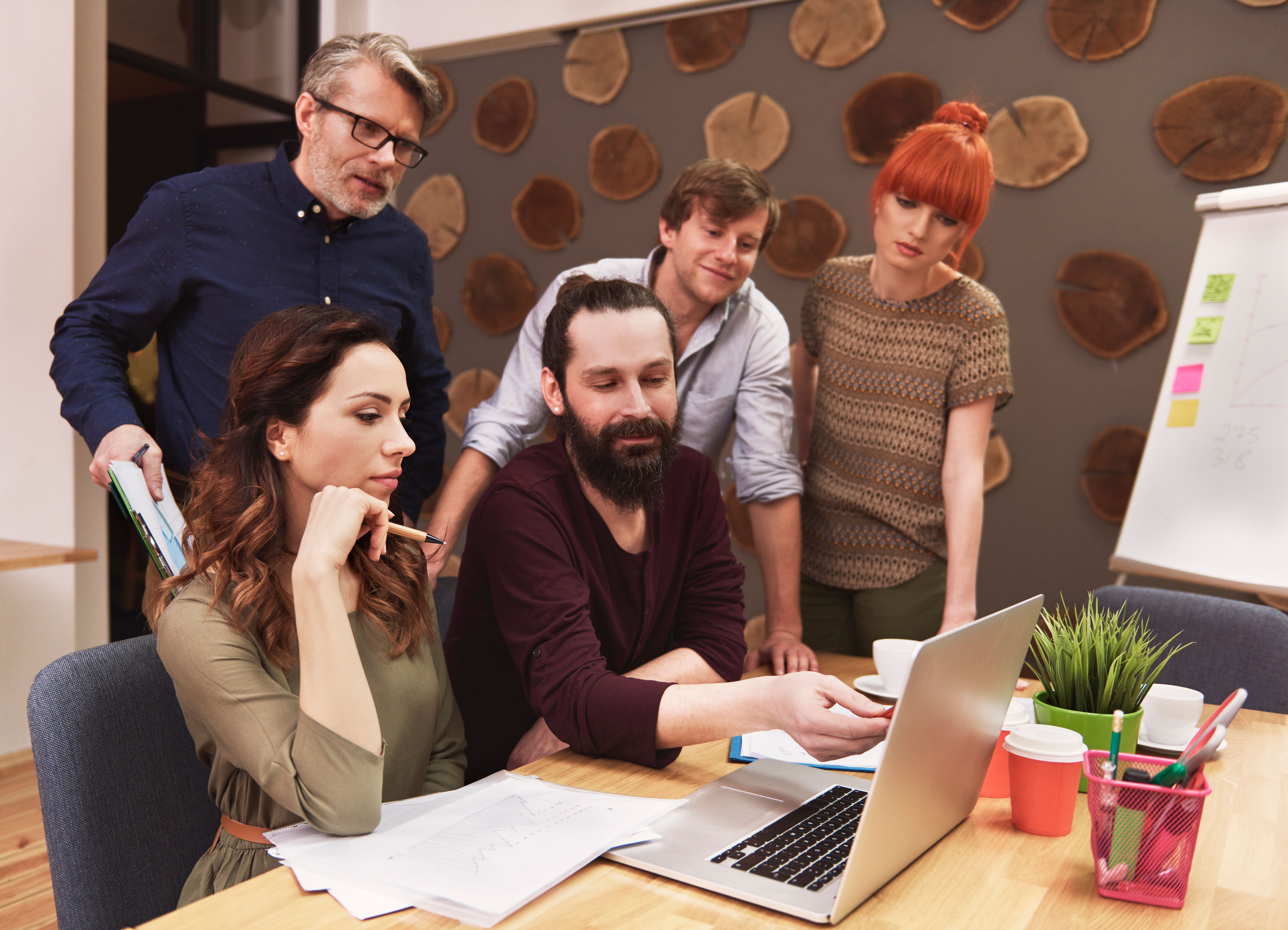 Digital product development team collaborating in an office