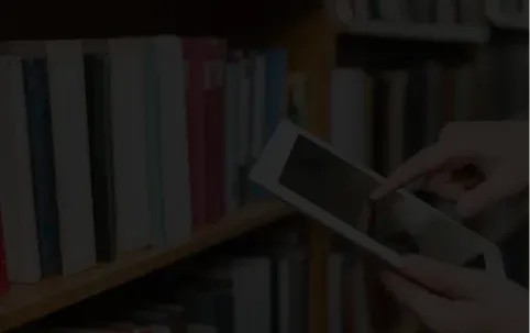 Person with a tablet in a library