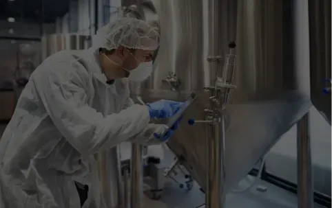 Professional technologist checking production factory